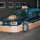 Illustration for article titled This Artist Turns Boring Rides Into Supercars At Night Using Cardboard